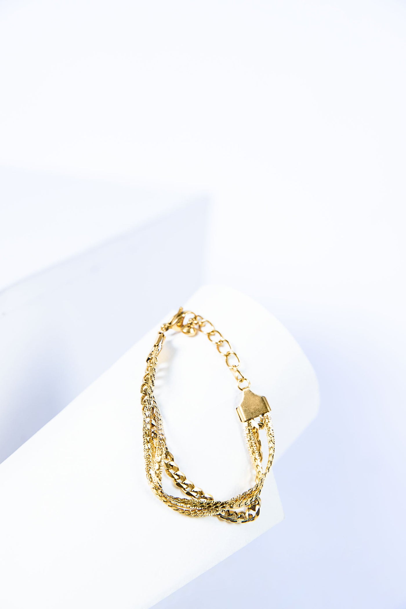 Embossed NK Inter-Frayed Chain Triple Bracelet